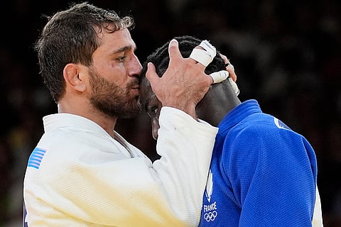 Azerbaijan's Hidayet Heydarov celebrates after defeating France's Joan-Benjamin Gaba